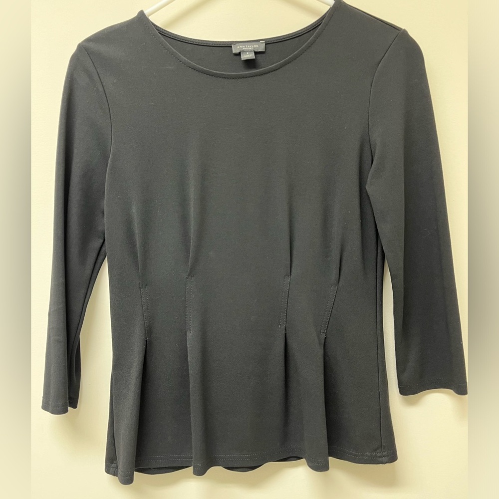 Black blouse with stretch.